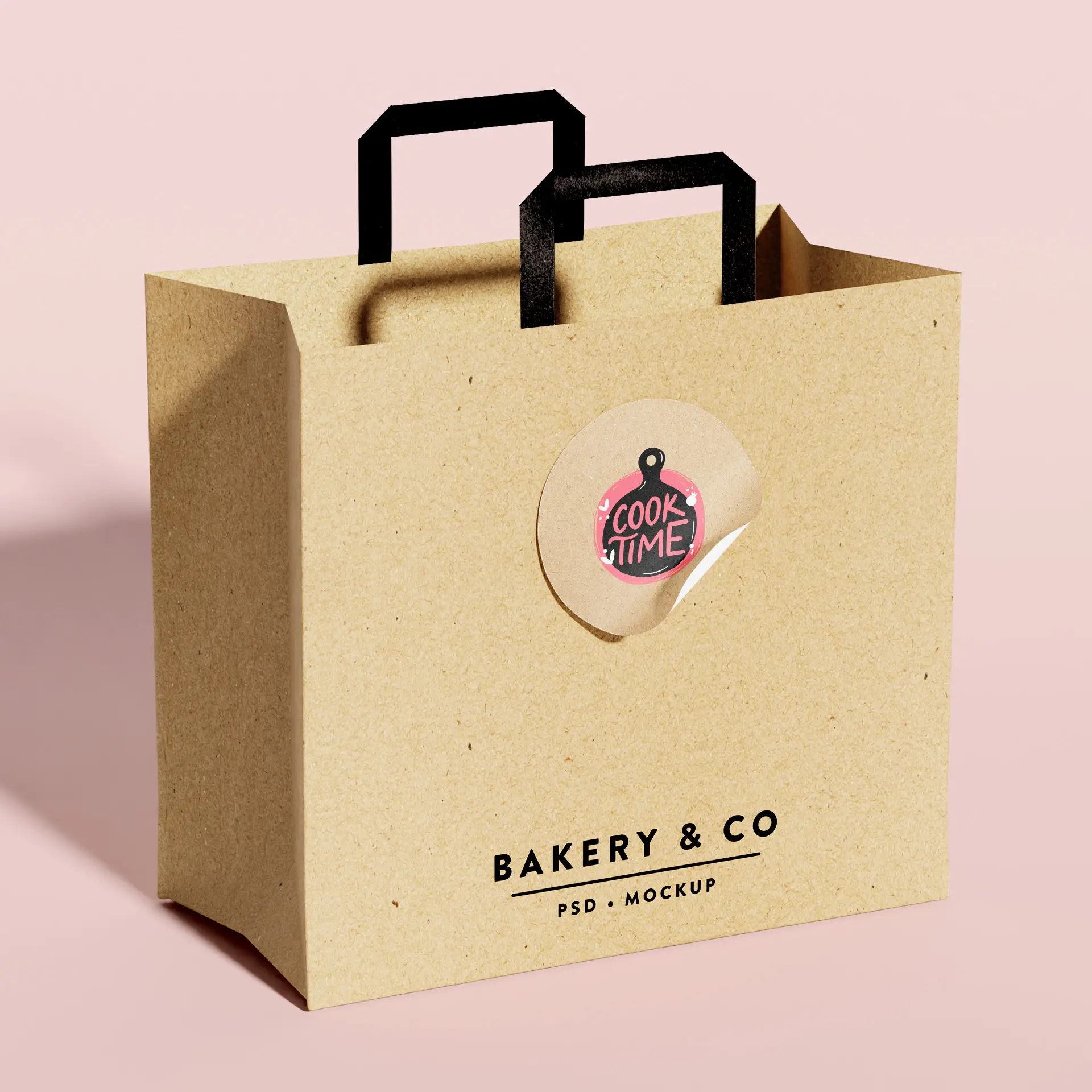 Brązowa torba z papieru kraft z czarnymi uchwytami, z okrągłą etykietą "Cook Time" oraz nazwą marki "Bakery & Co."