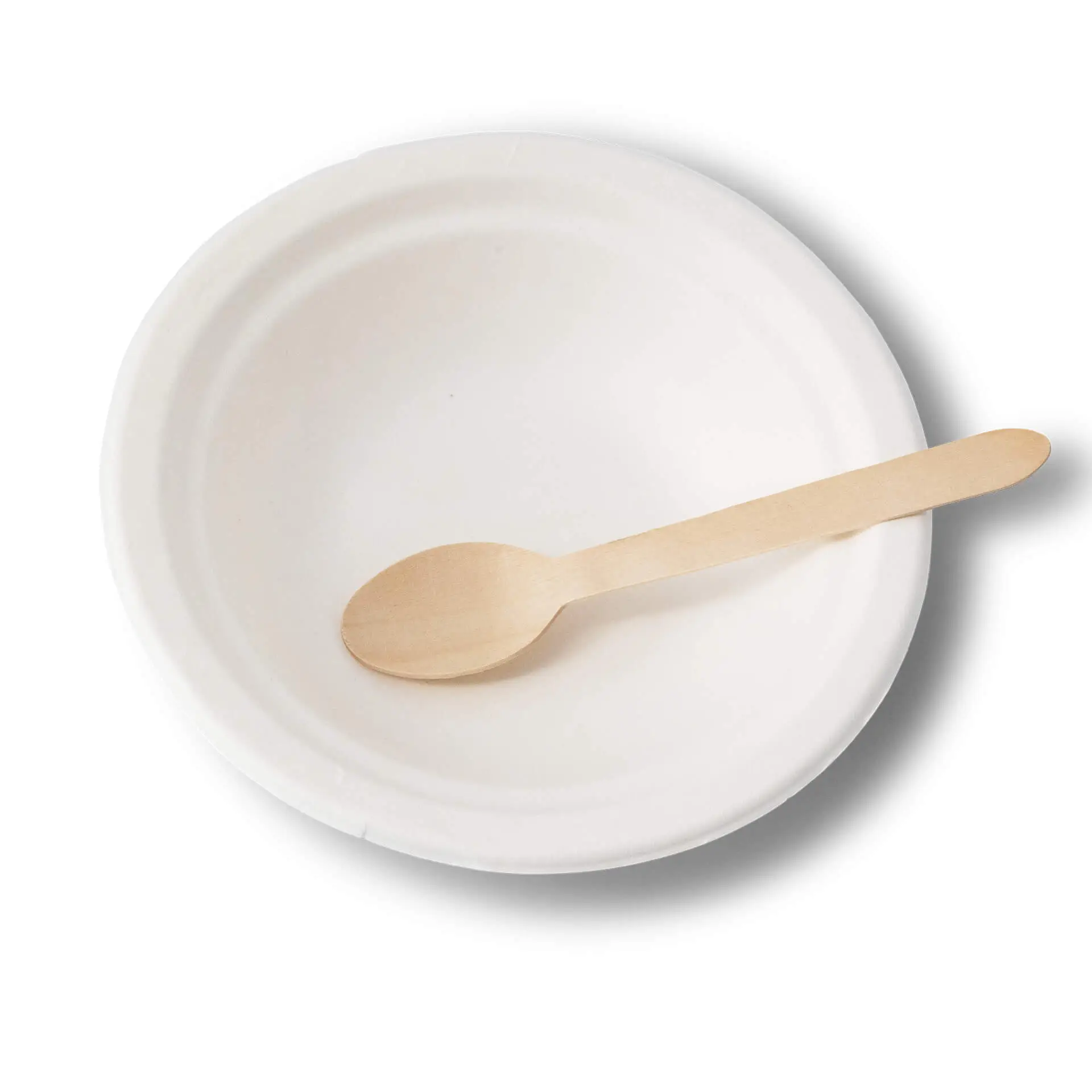 Okrągła biała miska z trzciny cukrowej z drewnianą łyżką w środku, odpowiednia do potraw gorących i zimnych.