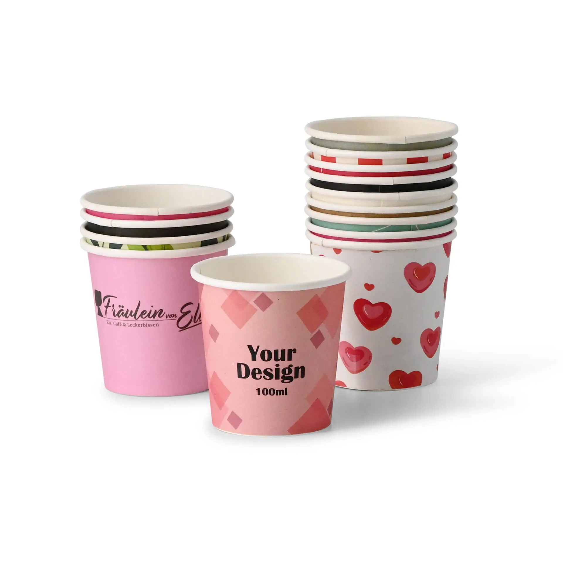 Różowy papierowy kubek z unikalnym wzorem z tekstem "Your Design 100ml"; kilka innych podobnych kubków z tyłu.