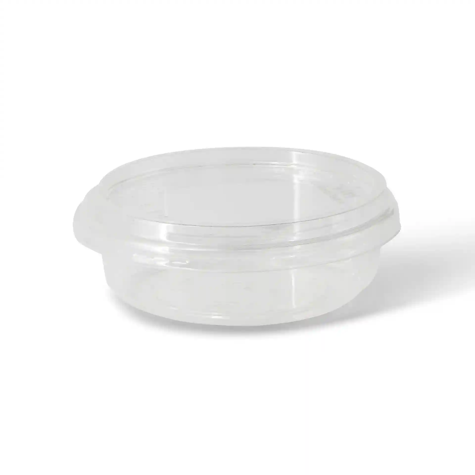 Przezroczysty okrągły pojemnik deli o średnicy 120 mm i wysokości 34 mm.